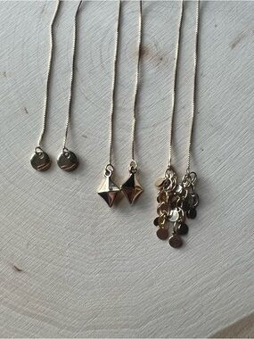 Dainty Yellow Gold-Colored Dangle Earrings feature various minimalist charms